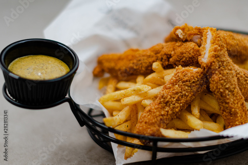 Cajun basket with sauce and chips