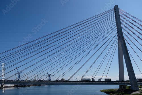Fototapeta Naklejka Na Ścianę i Meble -  Cable-stayed bridge on the Vistula river. Cars passing the bridge. Gdansk/Poland