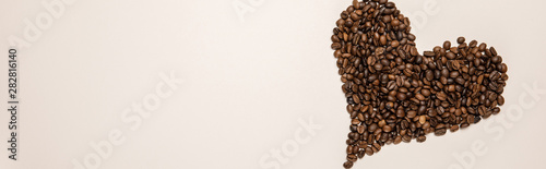 top view of heart made of grains on beige background, panoramic shot