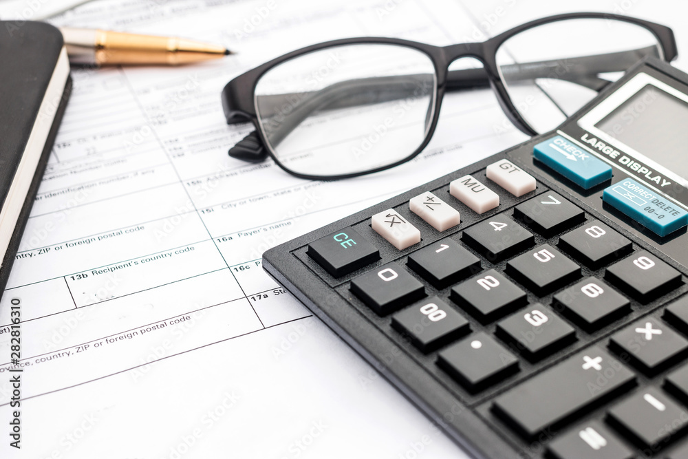 calculator and documents for working on the table, Finance and savings, Business concept. calculator and documents for working on the table, Finance and savings, Business concept.