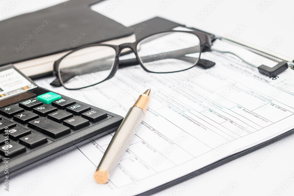 calculator and documents for working on the table, Finance and savings, Business concept. calculator and documents for working on the table, Finance and savings, Business concept.