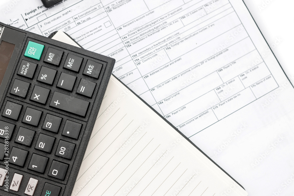 calculator and documents for working on the table, Finance and savings, Business concept. calculator and documents for working on the table, Finance and savings, Business concept.