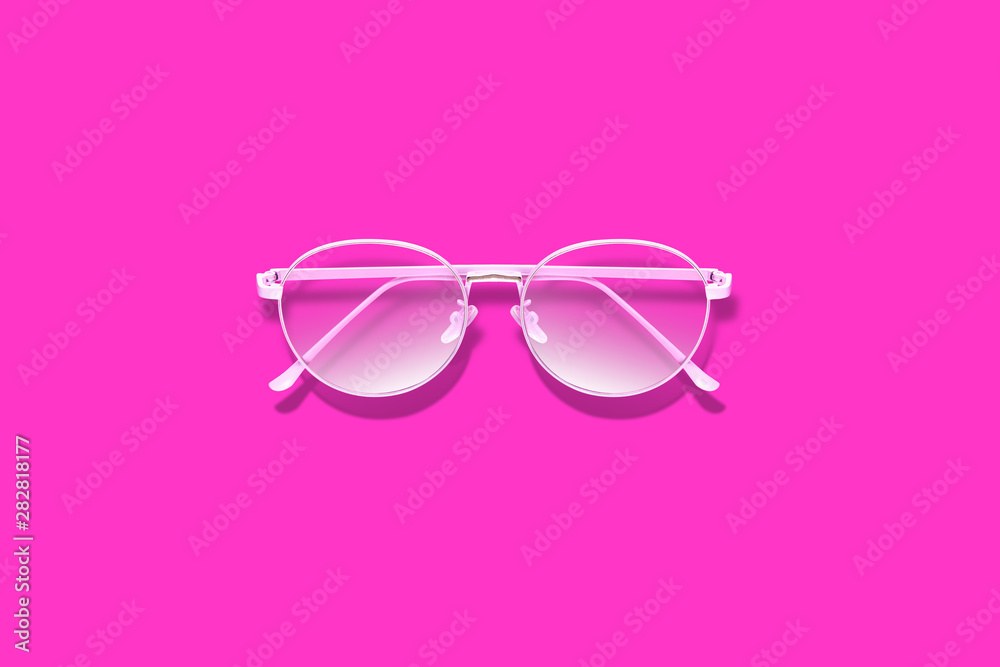 stylish pink glasses on pink background. creative layout. Minimalism and summer fashion for the beach. sale post card concpet. Banner. Advertising studio shot stylish pink glasses on pink background. creative layout. Minimalism and summer fashion for the beach. sale post card concpet. Banner. Advertising studio shot