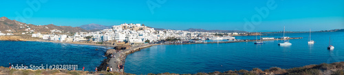 Fototapeta Naklejka Na Ścianę i Meble -  2 men playing bouzouki surrounded by the beauty of the island of Naxos