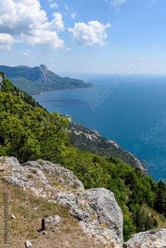 view of the Black Sea from the height of Mount Ayia  a cape on the southern coast of the Crimea  to the south-east of Balaclava. Sunny bright day with clouds on the sky. Spring view of the Crimea.