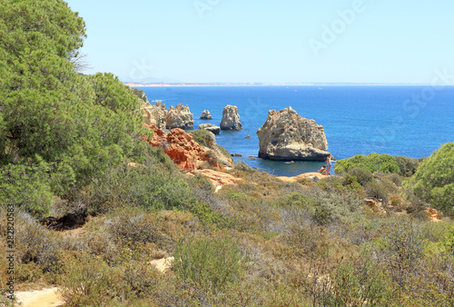 A landscape scene from Caminho Da Baleeira to Praia Do Arrifao and the Atlantic coastline near Albufeira photo