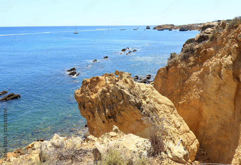 Jagged rocks overlooking the Atlantic Ocean near Albufeira in the Algarve region of Portugal