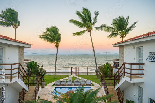 Ilha de Itamaraca, Brazil - Circa August 2019: Sunset view from a fancy condominium by the beach on Itamaraca Island (Pernambuco state) © Helissa