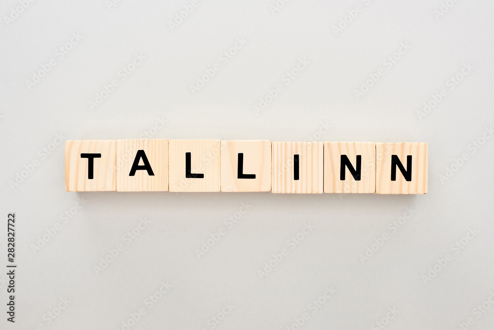 top view of wooden blocks with Tallinn lettering on white background top view of wooden blocks with Tallinn lettering on white background