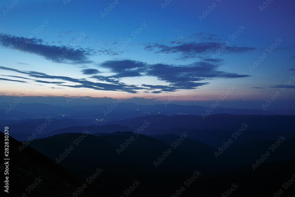 sunset in the mountains line of blue beautiful mountains