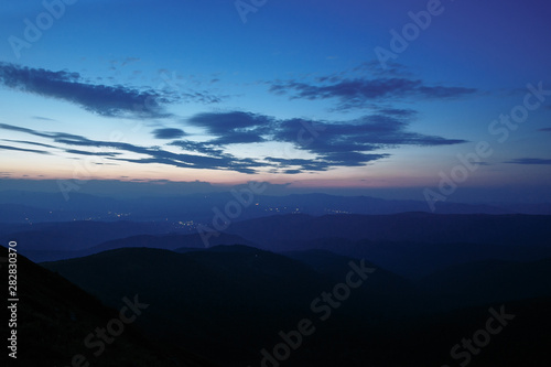sunset in the mountains line of blue beautiful mountains