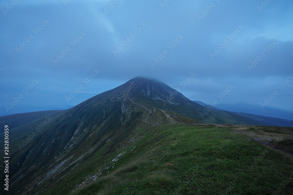 evening mountains indicated by fairy clouds