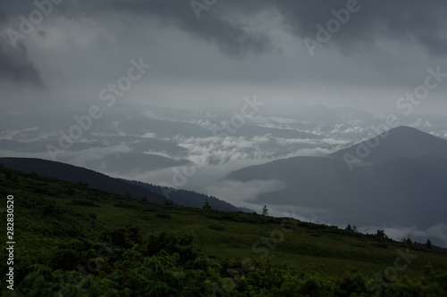 cloudy foggy morning in the mountains with beautiful panorama of the mountains