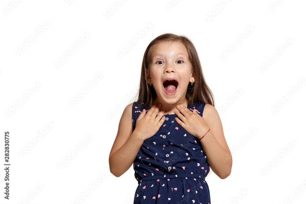 Close-up studio shot of beautiful brunette little girl posing isolated on white studio background. Close-up studio shot of beautiful brunette little girl posing isolated on white studio background.