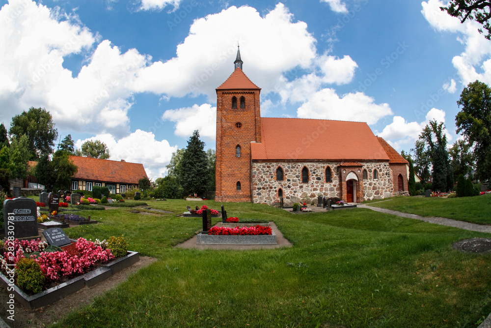 Fototapeta premium Old authentic brick church in a village
