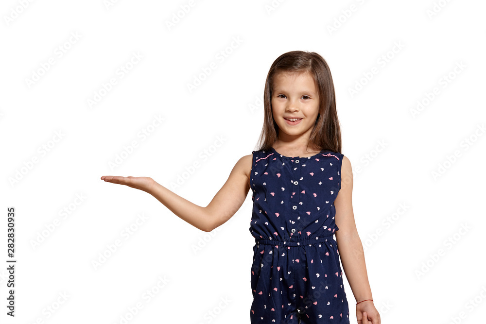 Close-up studio shot of beautiful brunette little girl posing isolated on white studio background. Close-up studio shot of beautiful brunette little girl posing isolated on white studio background.