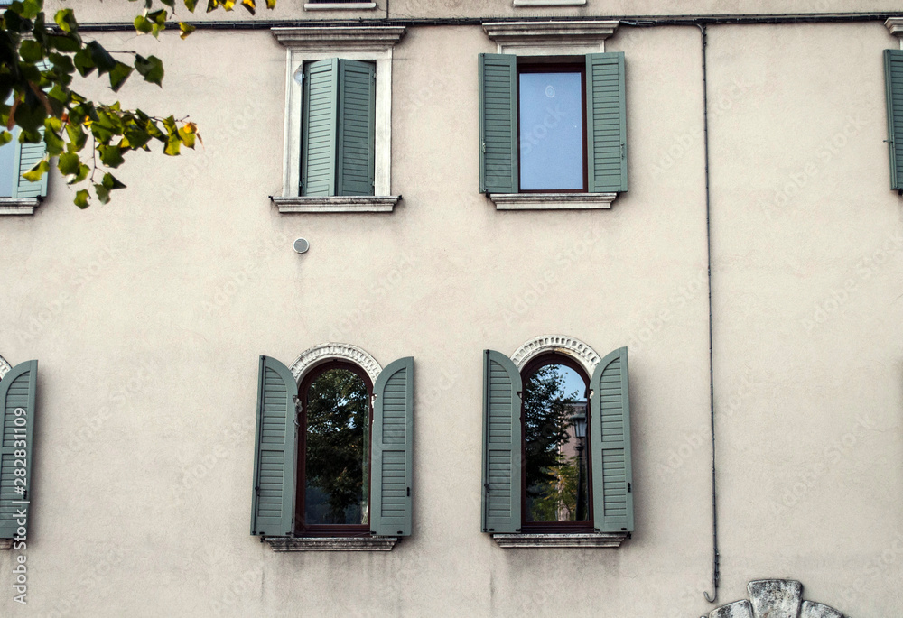 Vintage windows in old house Verona Italy