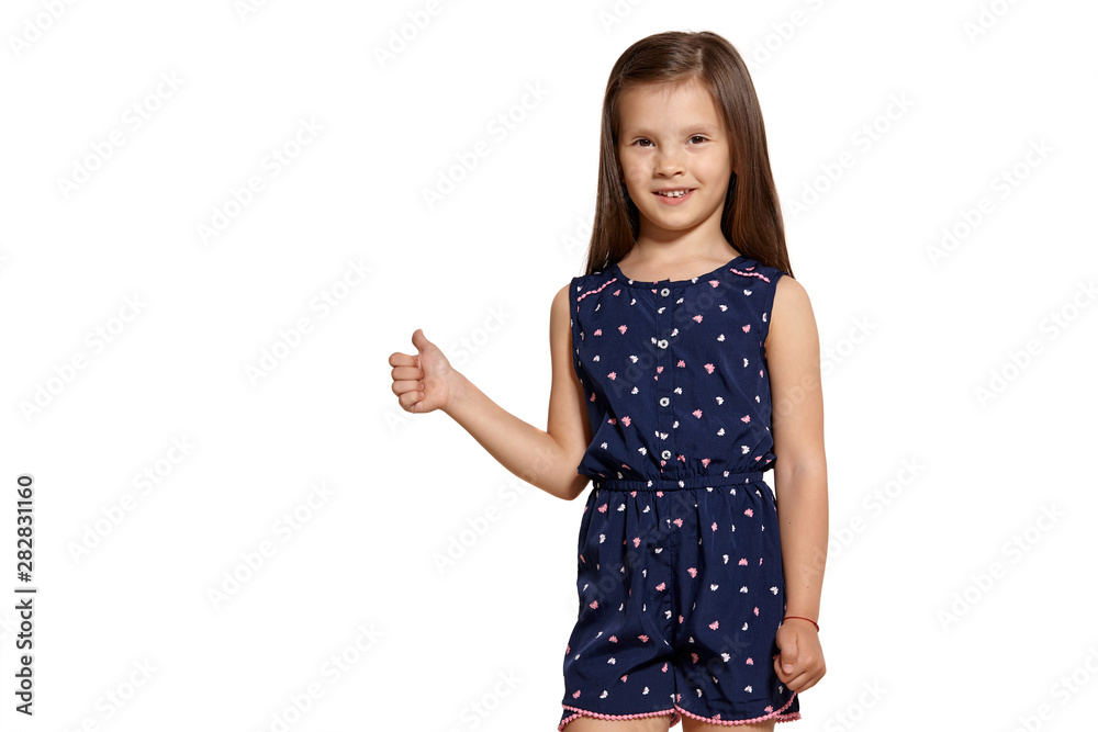 Close-up studio shot of beautiful brunette little girl posing isolated on white studio background. Close-up studio shot of beautiful brunette little girl posing isolated on white studio background.