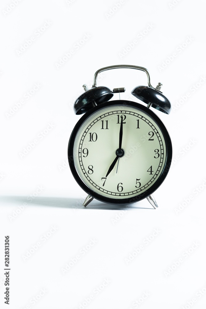 Black alarm clock isolated on white Black alarm clock isolated on white