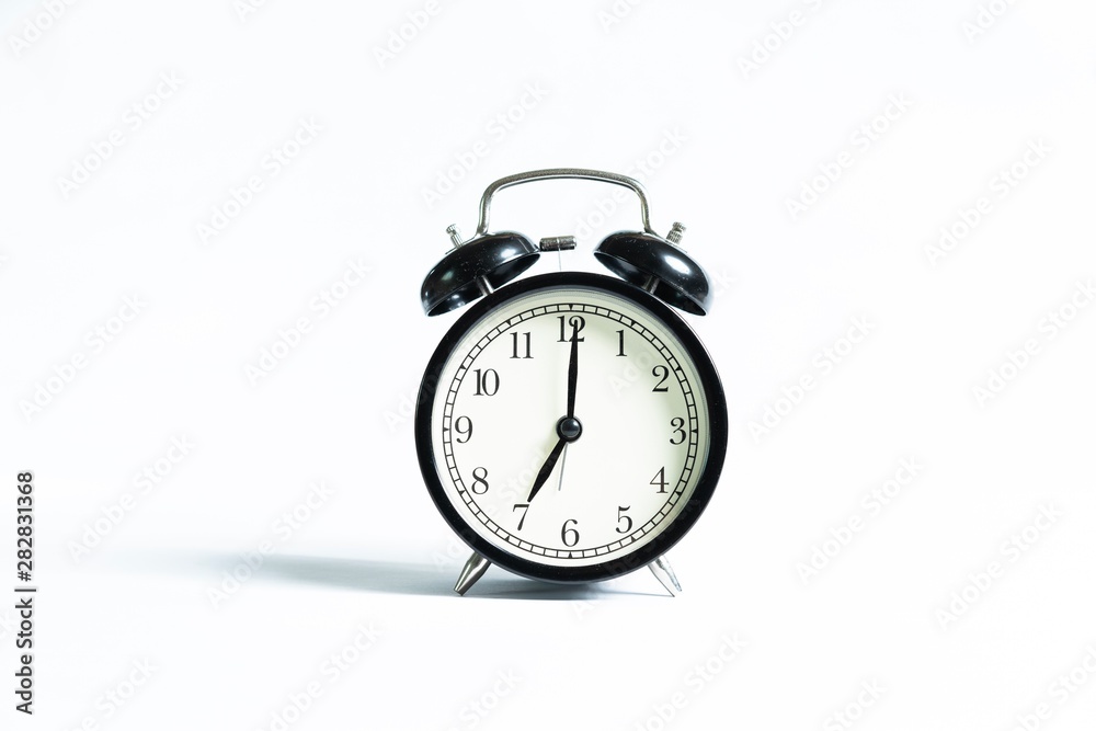 Black alarm clock isolated on white Black alarm clock isolated on white