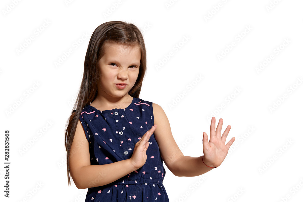 Close-up studio shot of beautiful brunette little girl posing isolated on white studio background. Close-up studio shot of beautiful brunette little girl posing isolated on white studio background.