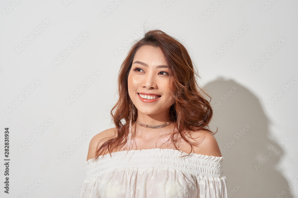 Asian pretty woman looking away on white background. Asian pretty woman looking away on white background.