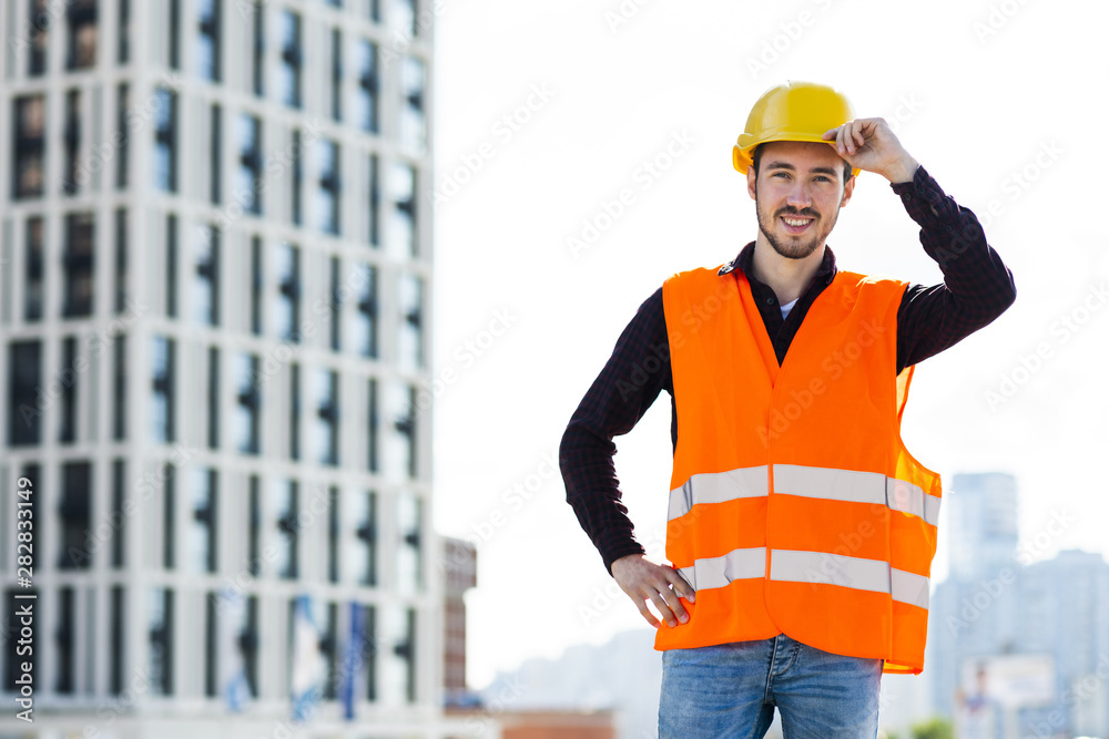 Medium shot portrait of smiling architect looking at camera Medium shot portrait of smiling architect looking at camera