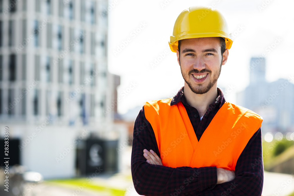 Medium shot portrait of construction worker looking at camera Medium shot portrait of construction worker looking at camera