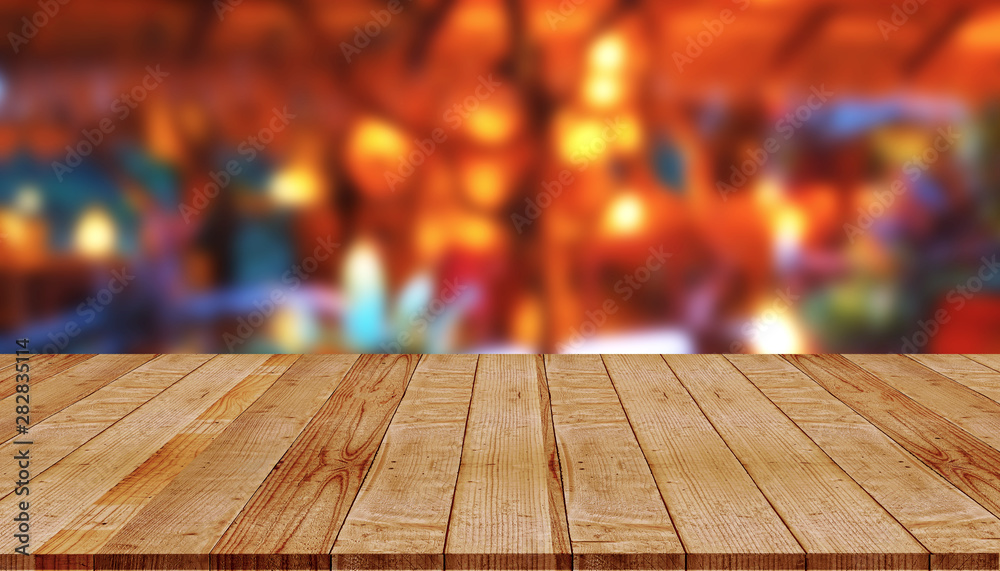 Empty wooden table with abstract blurred background of coffee shop Empty wooden table with abstract blurred background of coffee shop