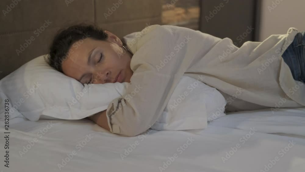 Woman sleeping hugging a pillow. Woman sleeping hugging a pillow.