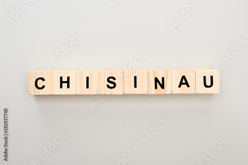 top view of wooden blocks with Chisinau lettering on grey background