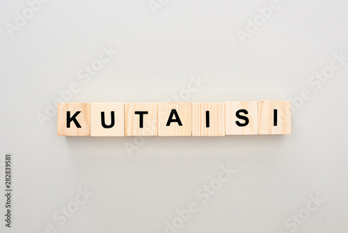 top view of wooden blocks with Kutaisi lettering on white background
