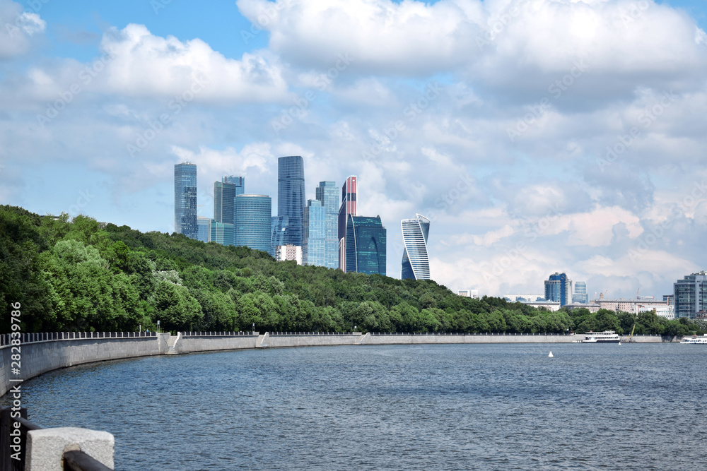 Obraz premium Moscow, Russia - July 8, 2019: The view of the Moscow International Business Center skyscrapers and cloudy sky from the Vorobyevskaya embankment