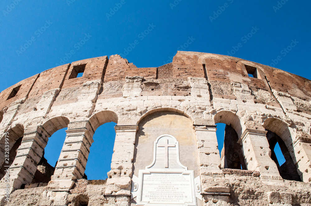 Detail with cross of Colosseum in Rome Italy
