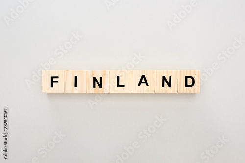 top view of wooden blocks with Finland lettering on white background