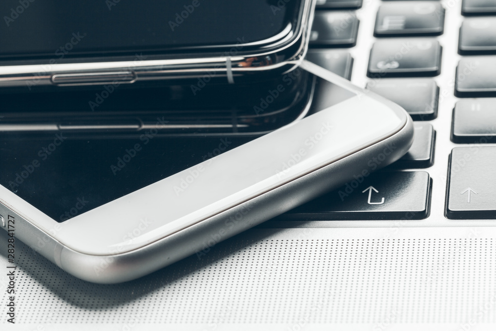 Laptop and mobile phone on the table. Workspace concept. Laptop and mobile phone on the table. Workspace concept.