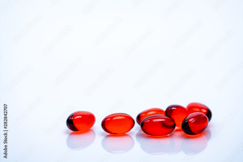 Red soft gel capsule pills isolated on white background. Pile of red soft  gelatin capsule. Vitamins and dietary supplements concept. Pharmaceutical  industry. Pharmacy drug store. Health care products. Photos | Adobe Stock