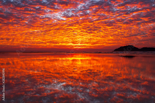 Fototapeta Naklejka Na Ścianę i Meble -  Sunrise with Clouds at Campeche Beach in Florianópolis Santa Catarina Brazil