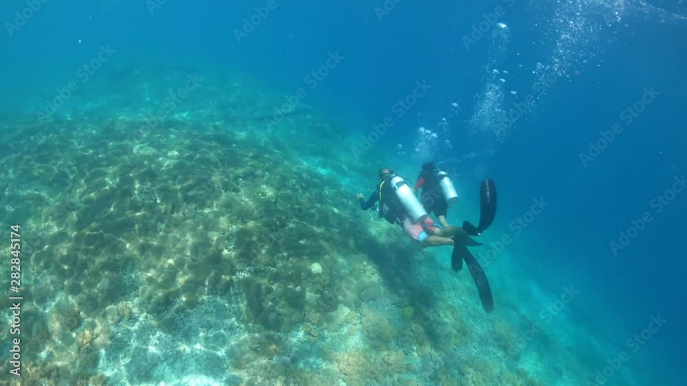 Time lapse of Child girl doing a scuba diving course in Gili Islands a world renown diving near Bali and Lombok Islands Indonesia. Time lapse of Child girl doing a scuba diving course in Gili Islands a world renown diving near Bali and Lombok Islands Indonesia.