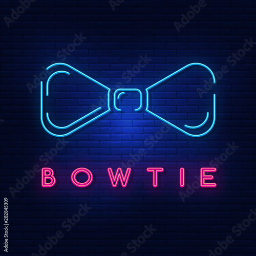 Neon lights men's bowtie. Bright advertising bowtie on the shirt. Modern vector logo, banner, shield, bowtie pattern . Night advertising on the background of a brick wall.