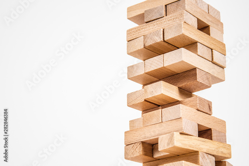 wood blocks tower game. planning, strategy and risk for business and finance. isolated background
