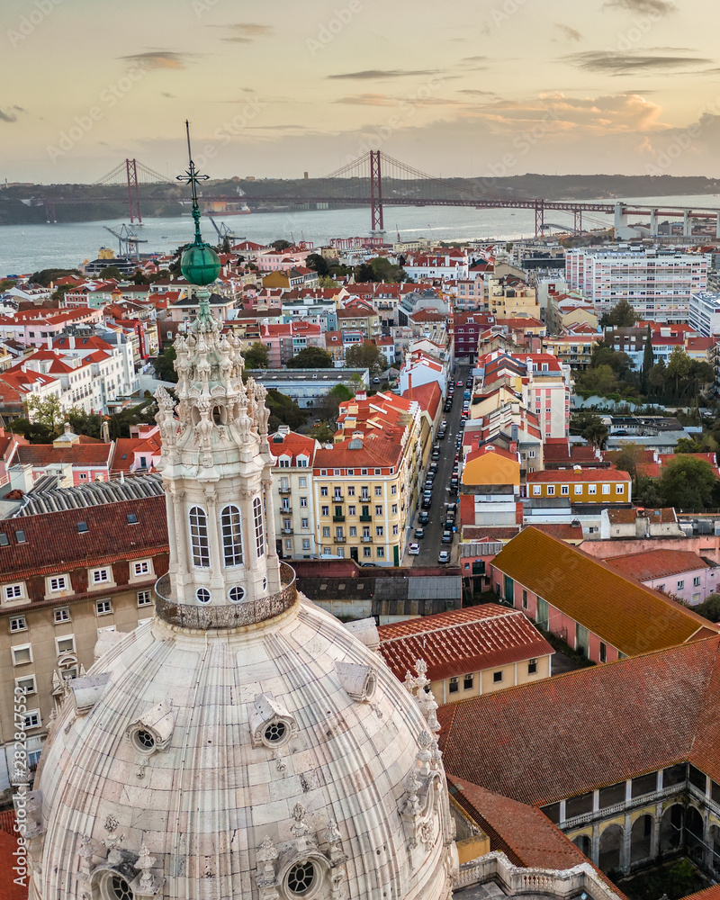 dome of the church basilica and rooftops of Lisbon Lapa, aerial view