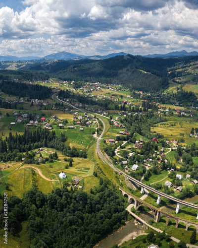 village in the mountains  old bridge viaduct  aerial panorama view