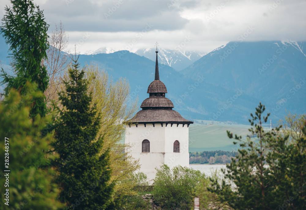 View of a gothic church Havranok at Lake Liptovska Mara. Slovakia