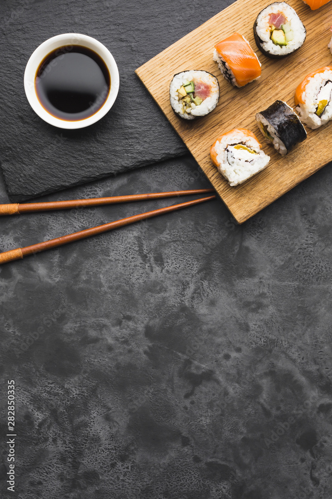 Fototapeta premium Flat lay sushi arrangement with copy space