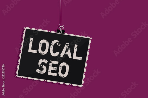 Word writing text Local Seo. Business concept for This is an effective way of marketing your business online Hanging blackboard message communication information sign purple background photo