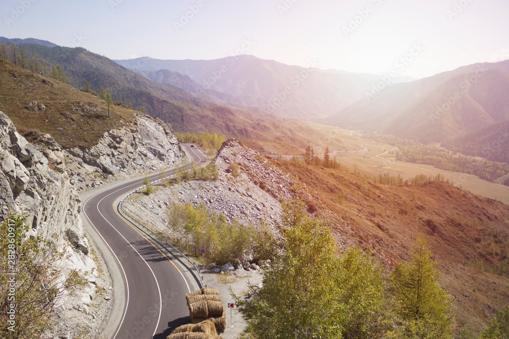 Road in mountain landscape with sunlight Road in mountain landscape with sunlight