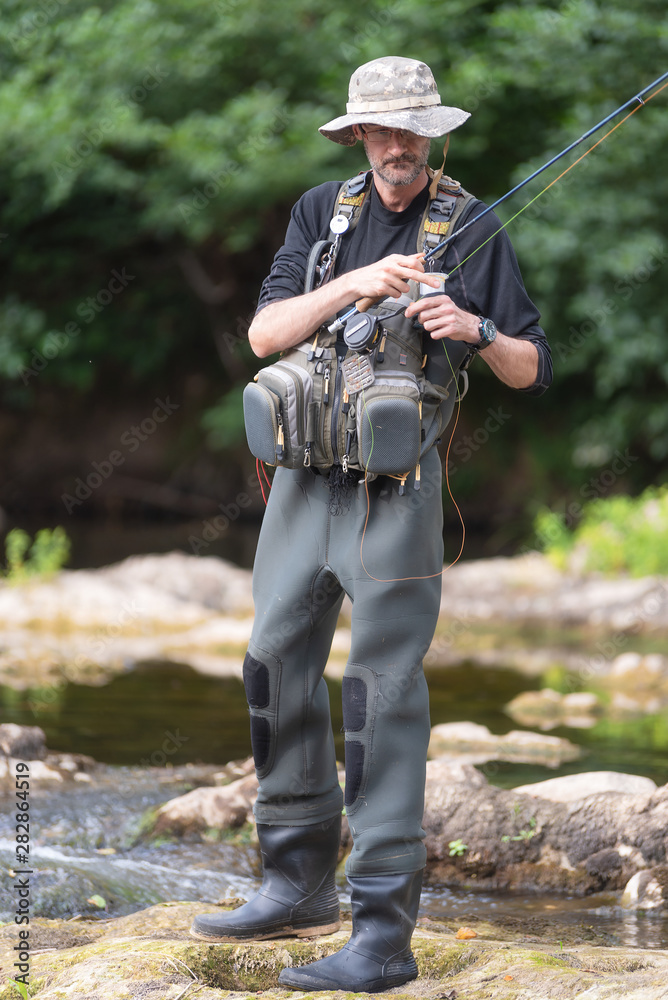 Fototapeta premium Pro fishermen with fishing rod, hobby and sport activity . 