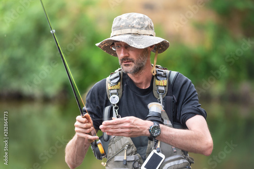 Pro fishermen with fishing rod, hobby and sport activity . 