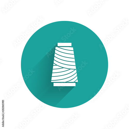 White Sewing thread on spool icon isolated with long shadow. Yarn spool. Thread bobbin. Green circle button. Vector Illustration